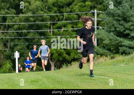 Danville, United States. 21st Aug, 2021. Runners compete during the 9th Annual Danville Cross Country 5K Community Run/Walk.The event, which benefits the Danville Area High School girls and boys cross country teams, resumed after being canceled in 2020 due to the COVID-19 pandemic. Credit: SOPA Images Limited/Alamy Live News Stock Photo