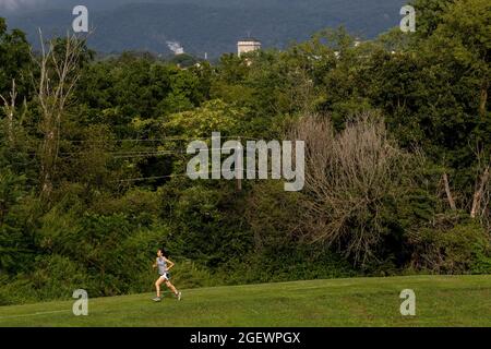 Danville, United States. 21st Aug, 2021. A girl is seen running during the 9th Annual Danville Cross Country 5K Community Run/Walk.The event, which benefits the Danville Area High School girls and boys cross country teams, resumed after being canceled in 2020 due to the COVID-19 pandemic. Credit: SOPA Images Limited/Alamy Live News Stock Photo