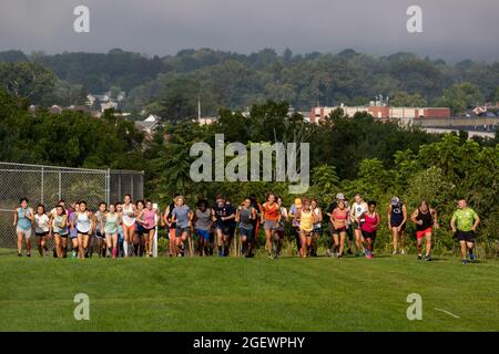 Danville, United States. 21st Aug, 2021. Runners are seen at the start of the 9th Annual Danville Cross Country 5K Community Run/Walk.The event, which benefits the Danville Area High School girls and boys cross country teams, resumed after being canceled in 2020 due to the COVID-19 pandemic. Credit: SOPA Images Limited/Alamy Live News Stock Photo