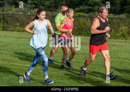 Danville, United States. 21st Aug, 2021. Runners are seen at the start of the 9th Annual Danville Cross Country 5K Community Run/Walk.The event, which benefits the Danville Area High School girls and boys cross country teams, resumed after being canceled in 2020 due to the COVID-19 pandemic. Credit: SOPA Images Limited/Alamy Live News Stock Photo