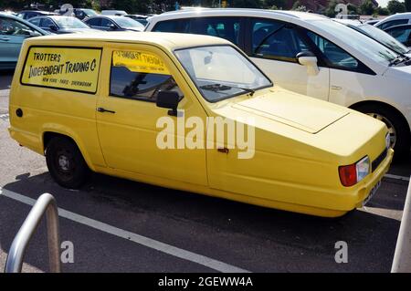 Yellow Reliant van with Trotter's Independent trading sign on the side.like the famous van in 'Only Fools And Horses TV series' Sheringham Norfolk Stock Photo