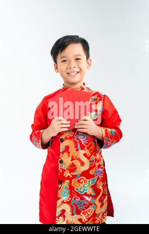 Cute asian boy in traditional Vietnamese ao dai Isolated on white