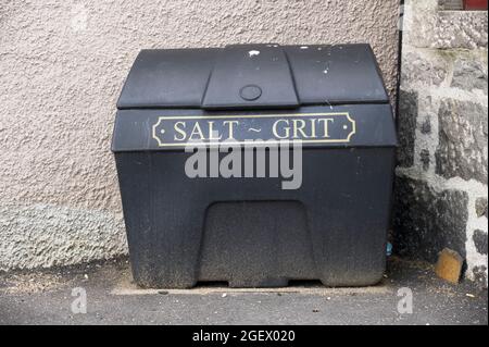 Salt grit black container for winter road safety on council road Stock Photo