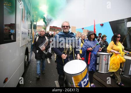 Manchester, UK. 21st August, 2021. Kill the Bill protesters are joined by Free Palestine activists in a march through the streets of  Manchester.  Protesters are opposing the Police and Crime Bill which gives the police more power to impose restrictions on protests.  Manchester, UK. Credit: Barbara Cook/Alamy Live News