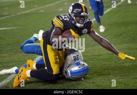 Pittsbugh, United States. 21st Aug, 2021. Pittsburgh Steelers wide receiver James Washington (13) makes the catch and gains 13 yards as Detroit Lions defensive back C.J. Moore (38) makes the tackle in the second quarter against the Detroit Lions at Heinz Field on August 21, 2021. Photo by Archie Carpenter/UPI Credit: UPI/Alamy Live News Stock Photo