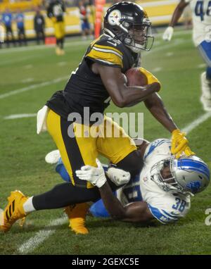 Pittsbugh, United States. 21st Aug, 2021. Pittsburgh Steelers wide receiver James Washington (13) makes the catch and gains 13 yards as Detroit Lions defensive back C.J. Moore (38) makes the tackle in the second quarter against the Detroit Lions at Heinz Field on August 21, 2021. Photo by Archie Carpenter/UPI Credit: UPI/Alamy Live News Stock Photo