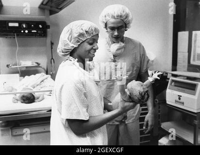Austin Texas USA, 1982: Childbirth story that ran in the Austin American-Statesman in 1982. Nurse in hospital nursery prepares to put newborn baby on scale. File 82-48 Box #12  birth was 6-2-1982. ©Bob Daemmrich Stock Photo