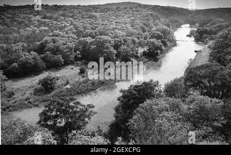 Austin, Texas USA, circa 1986: Barton Creek flowing through undeveloped, forested area on the west side of Austin. ©Bob Daemmrich Stock Photo