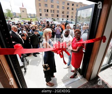 Milwaukee, Wisconsin, USA. 21st Aug, 2021. Former Wisconsin LT. Governor BARBARA LAWTON (left), DAVID BOWEN, State Representative District 10 (center), along with LENA C. TAYLOR, Wisconsin State Senate of District 4 (right) cut the ribbon to the front entrance of the new facility. Visitors attend the grand opening of the Institute for the Preservation of African American Music and Arts (IPAMA) at 3200 W. Hampton Avenue in Milwaukee, Wisconsin, Saturday August 21, 2021. IPAMA is designed to preserve the history of African-American artistic contributions in the performing and visual arts. (Cre Stock Photo