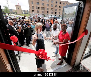 Milwaukee, Wisconsin, USA. 21st Aug, 2021. Former Wisconsin LT. Governor BARBARA LAWTON (left), DAVID BOWEN, State Representative District 10 (center), along with LENA C. TAYLOR, Wisconsin State Senate of District 4 (right) cut the ribbon to the front entrance of the new facility. Visitors attend the grand opening of the Institute for the Preservation of African American Music and Arts (IPAMA) at 3200 W. Hampton Avenue in Milwaukee, Wisconsin, Saturday August 21, 2021. IPAMA is designed to preserve the history of African-American artistic contributions in the performing and visual arts. (Cre Stock Photo