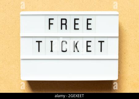 Lightbox with word free ticket on wood background Stock Photo