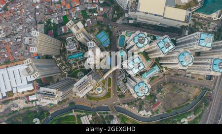 Aerial view of 'Taman Anggrek' the biggest shopping mall and apartment in Jakarta when sunrise. Jakarta, Indonesia, August 22, 2021 Stock Photo