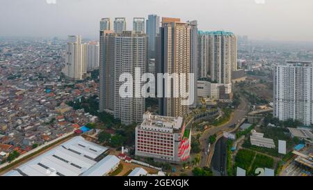 Aerial view of 'Taman Anggrek' the biggest shopping mall and apartment in Jakarta when sunrise. Jakarta, Indonesia, August 22, 2021 Stock Photo