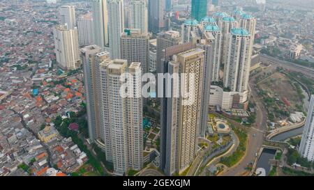 Aerial view of 'Taman Anggrek' the biggest shopping mall and apartment in Jakarta when sunrise. Jakarta, Indonesia, August 22, 2021 Stock Photo