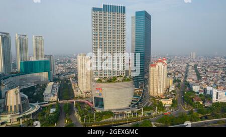 Aerial view of 'Taman Anggrek' the biggest shopping mall and apartment in Jakarta when sunrise. Jakarta, Indonesia, August 22, 2021 Stock Photo