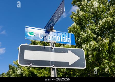 Gatineau, Canada - August 2, 2021: Allumettieres boulevard and champlain street sign in French with arrow at crossroad in Gatineau city of Quebec Stock Photo