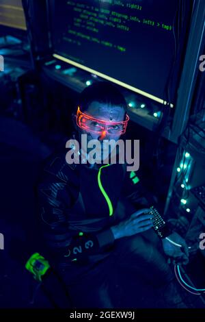Cyber hacker breaks into databases to obtain information using a computer. Cybercrime and data security concept. Stock Photo