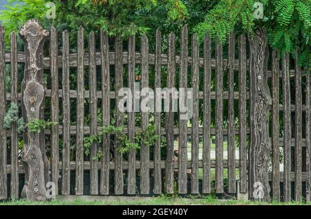 Wooden fence made of textured picket fence close-up as background Stock Photo