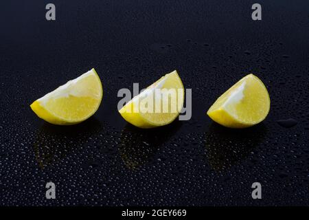 Lime fruit slices on black background Stock Photo