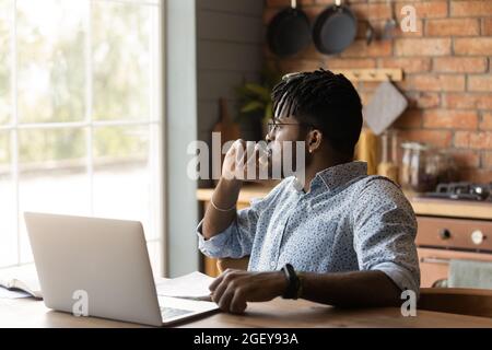 Thoughtful distance employee looking at window in deep thought Stock Photo
