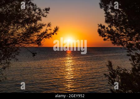 Sunset over Adriatic sea horizon, colorful red sky, island of Dugi Otok, Croatia