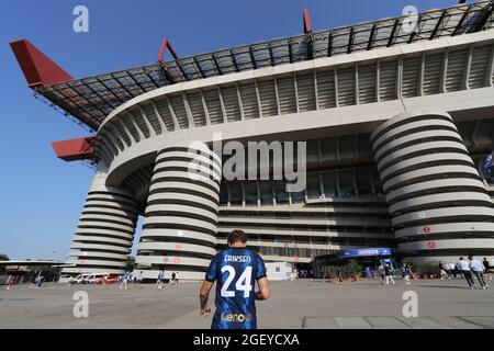 Milan, Italy, 21st August 2021. A fan wearing a new FC Internazionale jersey bearing the name of Christian Eriksen of FC Internazionale makes his way into the stadium during the Serie A match at Giuseppe Meazza, Milan. Picture credit should read: Jonathan Moscrop / Sportimage Stock Photo