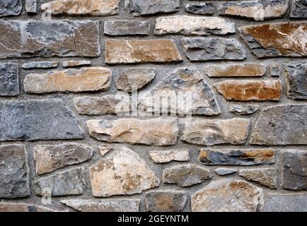 Background from an irregular natural stone wall Stock Photo