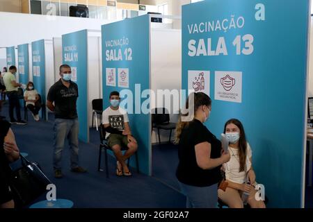 Lisbon, Portugal. 21st Aug, 2021. Parents wait for their children to receive their first dose of the COVID-19 vaccines at a vaccination center in Oeiras, Portugal, Aug. 21, 2021. Portugal started inoculating adolescents aged 12 to 15 against COVID-19. The country has reached its target of fully vaccinating 70 percent of its population against COVID-19. Credit: Pedro Fiuza/Xinhua/Alamy Live News Stock Photo