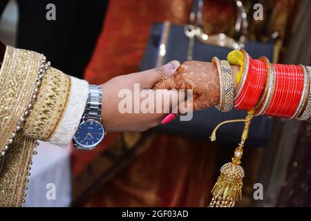 Groom Holding Bride Hand. Closeup Shot. Indian Wedding. Stock Photo