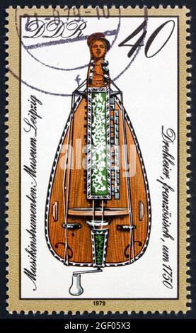 GERMANY - CIRCA 1979: a stamp printed in Germany shows French Barrel Lyre, 18th Century, Musical Instrument from Leipzig Museum, circa 1979 Stock Photo