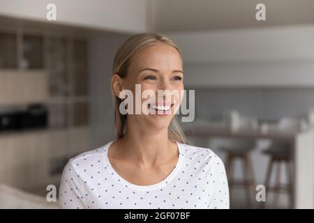 Happy beautiful 30s blonde woman home head shot portrait Stock Photo