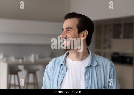 Happy millennial 30s man in casual home head shot portrait Stock Photo