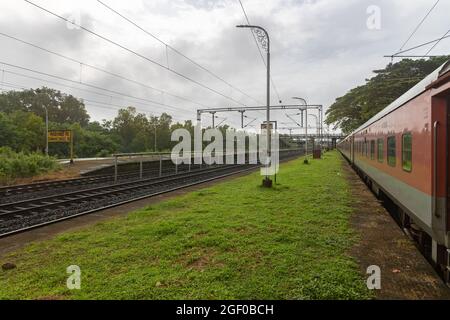 02413 New Delhi - Madgaon Rajdhani Special waiting for crossing at Sawantwadi Road Railway Station on Konkan Railway in Maharashtra, India Stock Photo