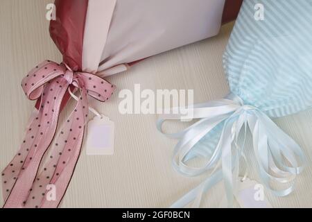 Bouquets in craft packaging. Tied with a ribbon tied to a bow. Close-up shot. Stock Photo
