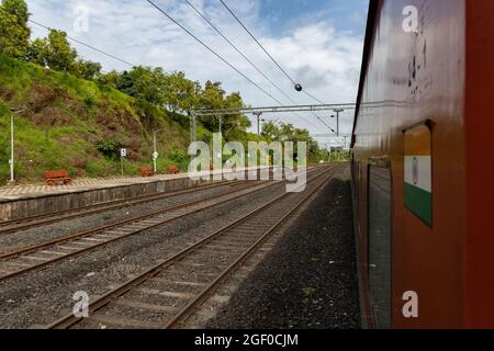 02413 New Delhi - Madgaon Rajdhani Special waiting for crossing at Thivim Railway Station on Konkan Railway in Goa, India Stock Photo