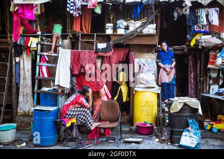 Mumbai, Maharashtra, India : Women stand outside their house at a slum in the Byculla district. Stock Photo