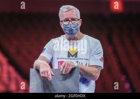 LAS VEGAS, NV - AUGUST 21: Freddie Roach looks on while Manny is answering questions during the post-fight press conference at T-Mobile Arena for Pacquiao vs. Ugas - Main Event on August 21, 2021 in Las Vegas, NV, United States. (Photo by Louis Grasse/PxImages) Credit: Px Images/Alamy Live News Stock Photo