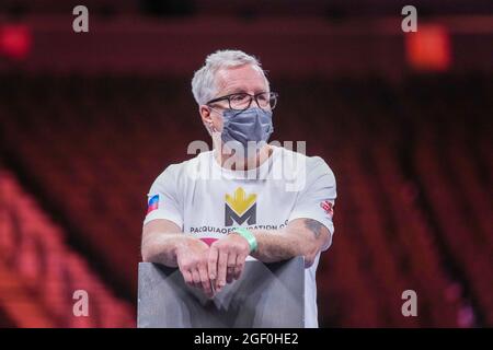 LAS VEGAS, NV - AUGUST 21: Freddie Roach looks on while Manny is answering questions during the post-fight press conference at T-Mobile Arena for Pacquiao vs. Ugas - Main Event on August 21, 2021 in Las Vegas, NV, United States. (Photo by Louis Grasse/PxImages) Credit: Px Images/Alamy Live News Stock Photo