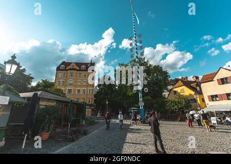 MUNIC, GERMANY - Aug 03, 2021: A summer day at Wiener Platz in Munich, Germany with an open street market under the bright sky Stock Photo