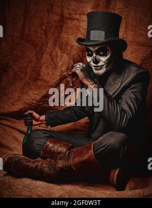 A young man in image of Baron Samedi, the Voodoo deity. Baron Saturday ...