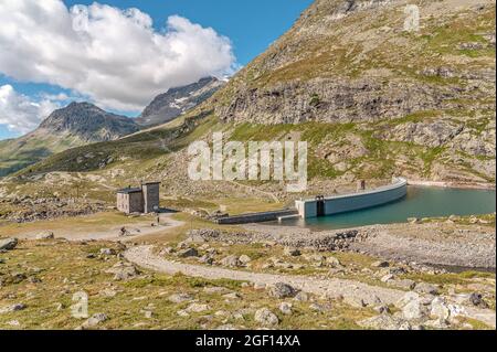 Dam wall at Lago Bianco at Bernina Pass, Grisons, Switzerland Stock Photo