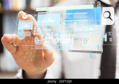 A hand touching a web application interface Stock Photo