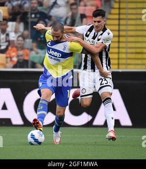 Udine. 23rd Aug, 2021. FC Juventus' Leonardo Bonucci (down) vies with Udinese's Ignacio Pussetto during a Serie A football match between Udinese and FC Juventus in Udine, Italy, Aug 22, 2021 Credit: Xinhua/Alamy Live News Stock Photo