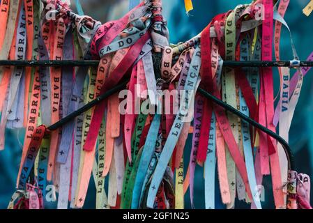 Salvador, Bahia, Brazil - July 18, 2021: Colored ribbons of Senhor do Bonfim tied to an iron gate in Pelourinho. Stock Photo