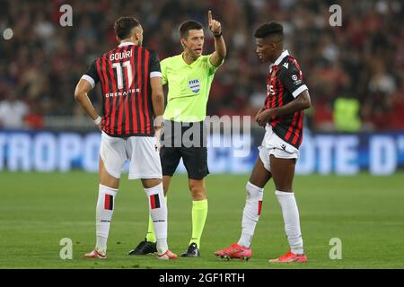 Nice, France, 22nd August 2021. The referee Benoit Bastien orders Hicham Boudaoui of OGC Nice to take his distance as he discusses with his team mate Amine Gouiri during the Lique 1 match at Allianz Riviera Stadium, Nice. Picture credit should read: Jonathan Moscrop / Sportimage Stock Photo