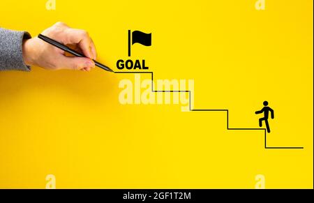 businessman hand drawing career ladder on yellow background. Business concept Stock Photo