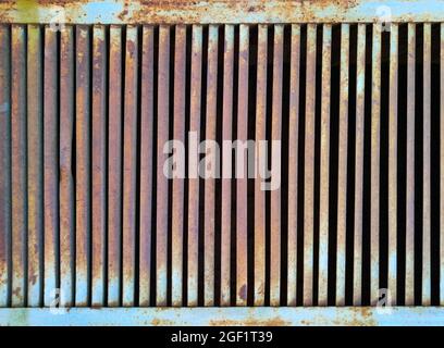 Old iron corroded metal grill - rusty painted jalousie Stock Photo