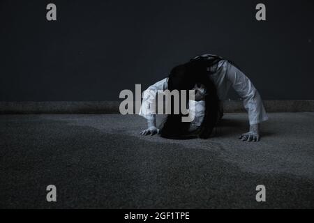 Woman ghost horror creepy her is crawling, halloween concept Stock Photo