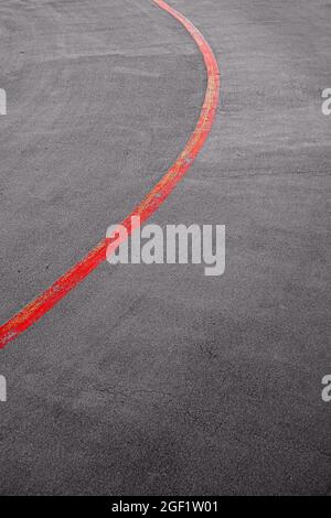 red line separating the lanes on a road Stock Photo