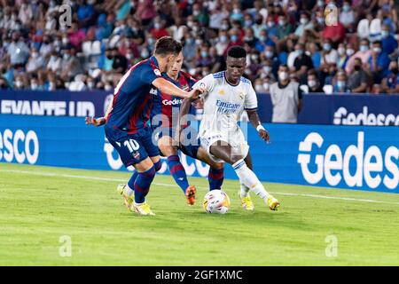 Valencia, Spain. 23rd Aug, 2021. FOOTBALL - LEVANTE UD VS REAL MADRID Enis Bardhi of Levante andVinicius Jose Paixao De Oliveira Junior of Real Madrid in action during the Spanish League, La Liga, football match between Levante and Real Madrid on August 22, 2021 at Ciutat de Valencia Stadium in Valencia, Spain. Photo: Xisco Navarro Credit: CORDON PRESS/Alamy Live News Stock Photo